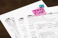 Tax time written on a bright sticker note paper clip for a tax Royalty Free Stock Photo