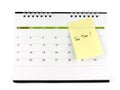 tax time notice message on yellow paper sticky note taped on desk calendar page Royalty Free Stock Photo