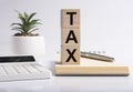 Tax word inscription on accountant financial workplace