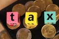 Tax word with money. Royalty Free Stock Photo