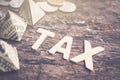 Tax word on wood table with money Royalty Free Stock Photo