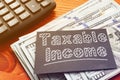 Taxable Income is shown on the conceptual business photo