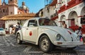 Mini taxi against the Cathedral of Taxco, Mexico
