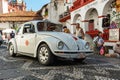 Mini taxi against the Cathedral of Taxco, Mexico