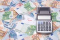 Taxes concept - money and calculator