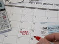 TAXES DUE Reminder Written by Hand on a Calendar in 2023