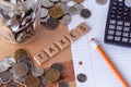 `Taxes` spelled out in wooden letter tiles