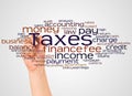 Taxes word cloud and hand with marker concept