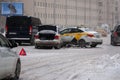 Taxi accident in snowy weather in winter, car crash on slippery road in Moscow