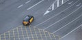 Taxi cab crossing empty lanes in Barcelona