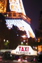 Taxi cab sign and Eiffel Tower