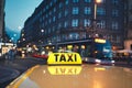 Taxi car on the city street Royalty Free Stock Photo