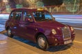 Taxi car `London Taxi TX4` in purple color