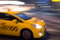 Taxi car moving fast in the night city in motion blur Royalty Free Stock Photo