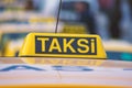 Taxi car roof sign on bokeh background