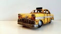 Taxi car. Vintage yellow and iron pattern model.