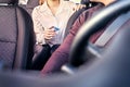 Taxi and card payment. Customer paying cab fare. Woman giving money to driver. Transaction security, scam or fraud concept. Royalty Free Stock Photo