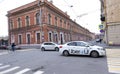 Taxi cars at the intersection in the center of St. Petersburg, old buildings in classic style, pedestrian crossing, people walking Royalty Free Stock Photo