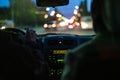 Taxi driver in the car in the city traffic f Royalty Free Stock Photo