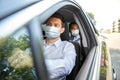 Taxi driver in face protective mask driving car Royalty Free Stock Photo