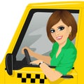 Taxi female driver with sunglasses in yellow car smiling Royalty Free Stock Photo