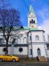 Taxi in front of the white cathedral (Kaliningrad, Russia) Royalty Free Stock Photo