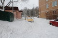 Taxi got stuck in snowdrift after night snowstorm in yard in Vidnoe Royalty Free Stock Photo