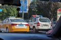 A taxi and a police car