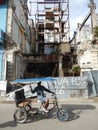 TAXI RICKSHAW AND RUINS OF A BUILDING, HAVANA, CUBA