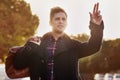 Taxi. Shot of a handsome young man hailing a cab. Royalty Free Stock Photo