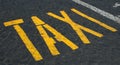 Taxi sign on cobblestones Royalty Free Stock Photo