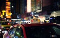Taxi sign with defocused lights blur in Chinatown in Bangkok at night , Thailand , Southeast asia Royalty Free Stock Photo