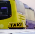 Taxi sign on rooftop of the cab