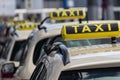 Taxi signs, taxi cars waiting in line Royalty Free Stock Photo