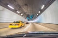 Taxi speeding up along Miami tunnel, blurred fast motion