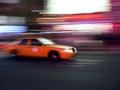 Taxi speeds through the streets Royalty Free Stock Photo