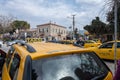 Seferihisar, Izmir, Turkey - 03.09.2021: Turkish Taxicab stand and a lot of waiting taxi cars and a costumer with mask waiting