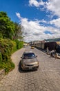 Taxi and street work in Jocotenango neighborhood, Guatemala Royalty Free Stock Photo