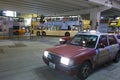 Taxi under overpass at night