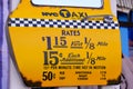 Taxi yellow cab of nyc car door with sticker fare Royalty Free Stock Photo