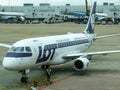 LOT Polish Airlines Embraer taxiing to the stand in Brussels airport in Belgium.