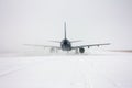 Taxiing passenger aircraft in a snow blizzard