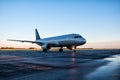 Taxiing passenger airplane at the airport apron