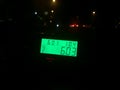 A taximeter that tells the rate and total costs of the ride seen from inside the taxi Royalty Free Stock Photo