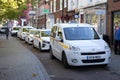 Taxis in a taxi rank in St Albans, Hertfordshire in the UK