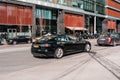 Taxis waiting for passengers outside the hospital on a sunny spring day