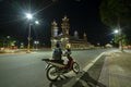 A tourist motorbike in front of the old holy temple in night