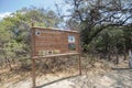 Tayrona national natural park entrance sign with endemic vegetation at background