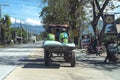 Tayug, Pangasinan - a farming tractor carrying rice using the local highway