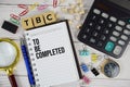TBC - To Be Completed acronym on notepad, business and financial concept background Royalty Free Stock Photo